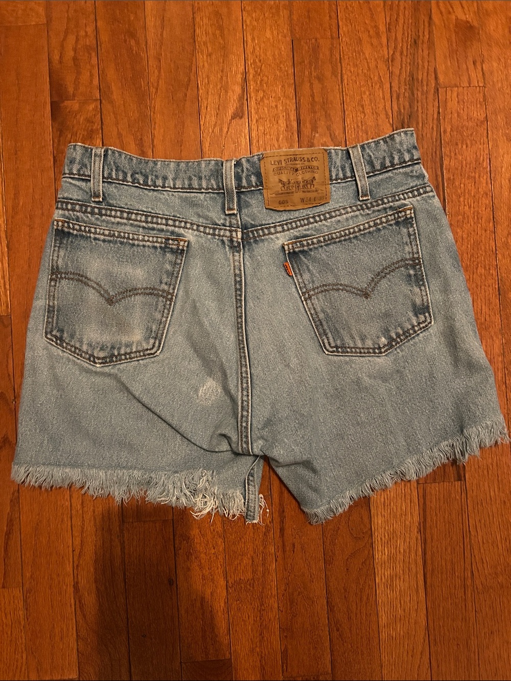 Levi's Faded Blue Frayed Hem Denim Shorts - Women's